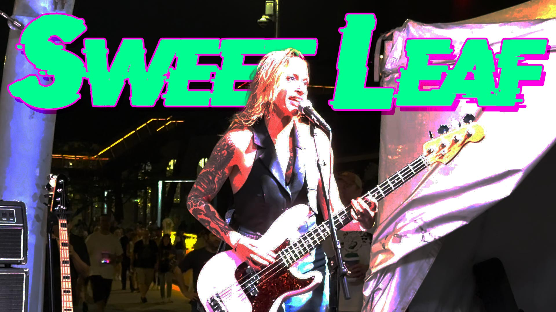 Sweet Leaf text behind Hilary signing the cover of the Black Sabbath song.